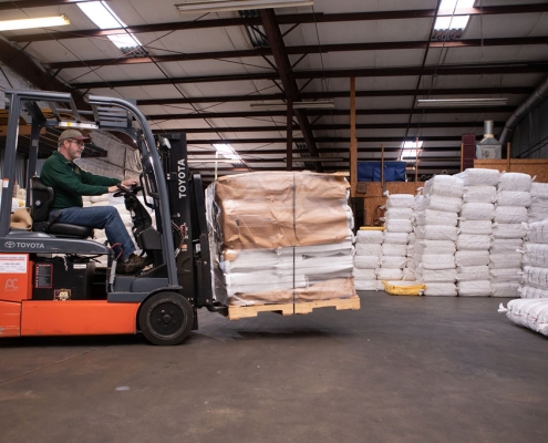 truck moving custom bags in warehouse