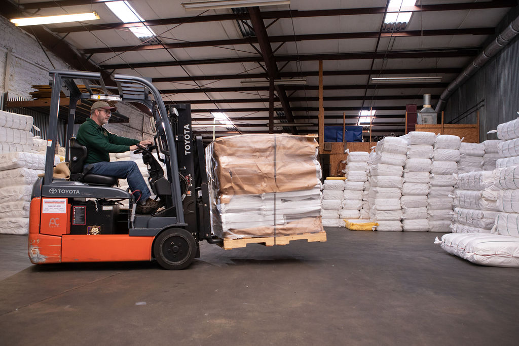 truck moving custom bags in warehouse