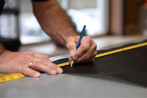 closeup of sewer working on custom vinyl fabrication